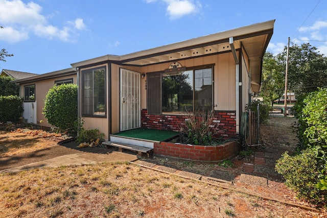 4100 Fort Peck St, Shasta Lake, CA 96019 - rear view of house featuring brick siding