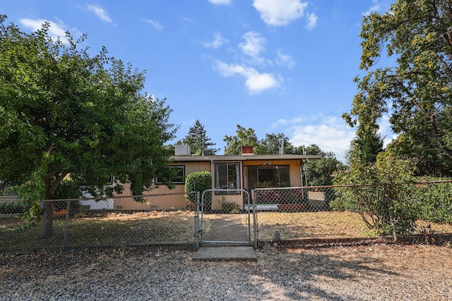 4100 Fort Peck St, Shasta Lake, CA 96019 - view of front facade with a gate and a chimney