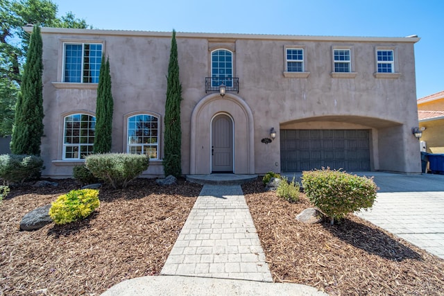 5569 Diamond Ridge Dr, Redding, CA 96003 - mediterranean / spanish home with a garage, stucco siding, and decorative driveway