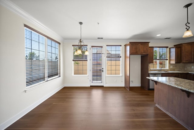 5569 Diamond Ridge Dr, Redding, CA 96003 - kitchen featuring dishwasher, ornamental molding, light stone counters, dark wood-type flooring, and decorative backsplash
