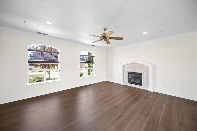 5569 Diamond Ridge Dr, Redding, CA 96003 - unfurnished living room with dark wood finished floors, ceiling fan, a tile fireplace, ornamental molding, and recessed lighting