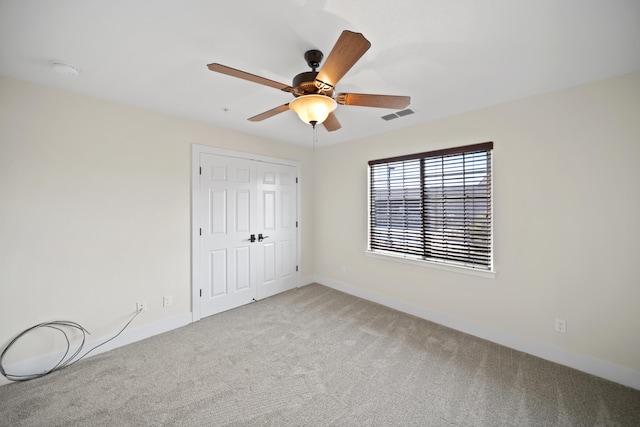 5569 Diamond Ridge Dr, Redding, CA 96003 - unfurnished bedroom featuring carpet, a closet, and ceiling fan