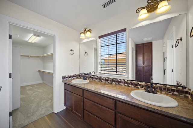 5569 Diamond Ridge Dr, Redding, CA 96003 - full bath featuring double vanity, wood finished floors, and a spacious closet