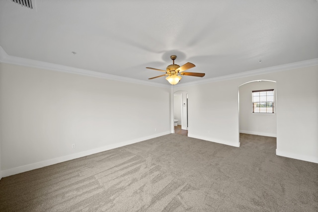 5569 Diamond Ridge Dr, Redding, CA 96003 - carpeted spare room featuring arched walkways, crown molding, and a ceiling fan