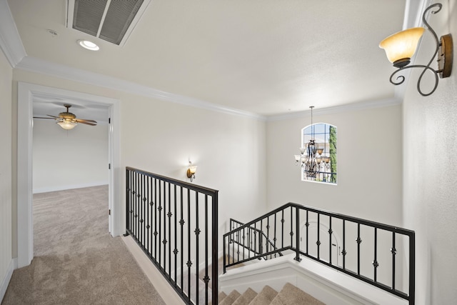 5569 Diamond Ridge Dr, Redding, CA 96003 - stairway featuring a chandelier, carpet, crown molding, and a ceiling fan