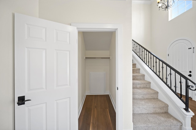 5569 Diamond Ridge Dr, Redding, CA 96003 - stairs with wood finished floors and a chandelier