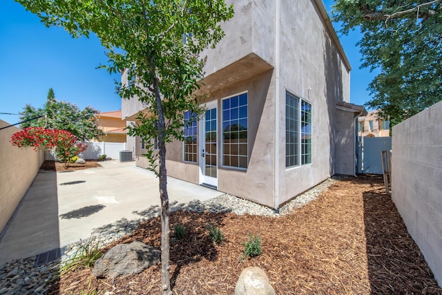 5569 Diamond Ridge Dr, Redding, CA 96003 - view of property exterior featuring a fenced backyard, a patio area, and stucco siding