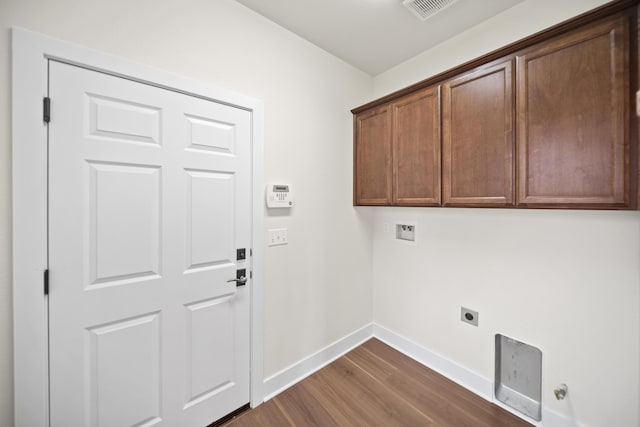 5569 Diamond Ridge Dr, Redding, CA 96003 - laundry area with dark wood-style floors, cabinet space, hookup for an electric dryer, and hookup for a washing machine