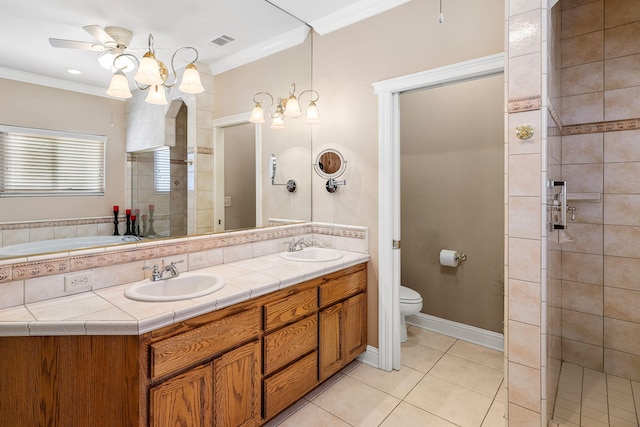 1533 Spanish Bay Dr, Redding, CA 96003 - bathroom featuring double vanity, a shower stall, tile patterned flooring, ceiling fan, and ornamental molding