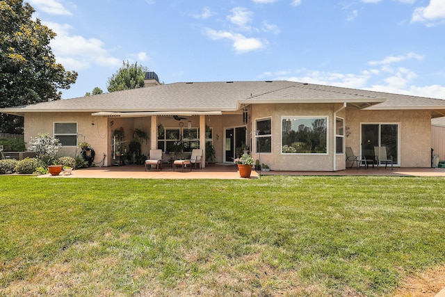 1533 Spanish Bay Dr, Redding, CA 96003 - back of property with a patio, stucco siding, ceiling fan, a lawn, and a chimney
