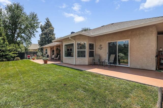 1533 Spanish Bay Dr, Redding, CA 96003 - rear view of property with stucco siding and a patio