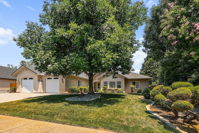 1533 Spanish Bay Dr, Redding, CA 96003 - ranch-style house featuring driveway, an attached garage, a front lawn, and stucco siding