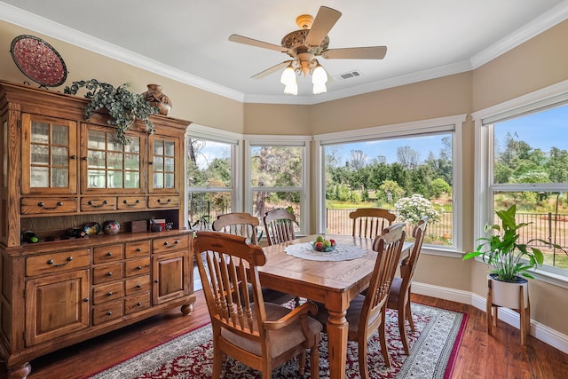 1533 Spanish Bay Dr, Redding, CA 96003 - dining room with dark wood-style flooring, a ceiling fan, and crown molding