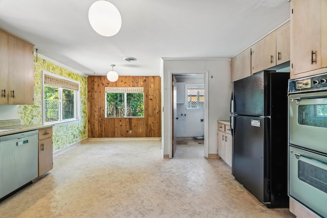 1198 Denton Way, Redding, CA 96002 - kitchen featuring freestanding refrigerator, dishwasher, double oven, light countertops, and wood walls