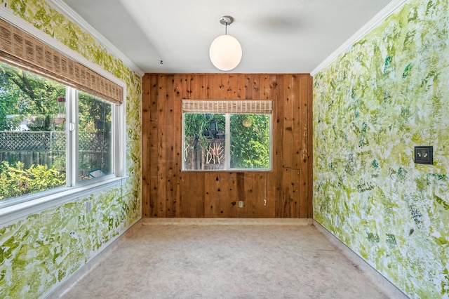 1198 Denton Way, Redding, CA 96002 - empty room featuring crown molding, wooden walls, carpet floors, and wallpapered walls