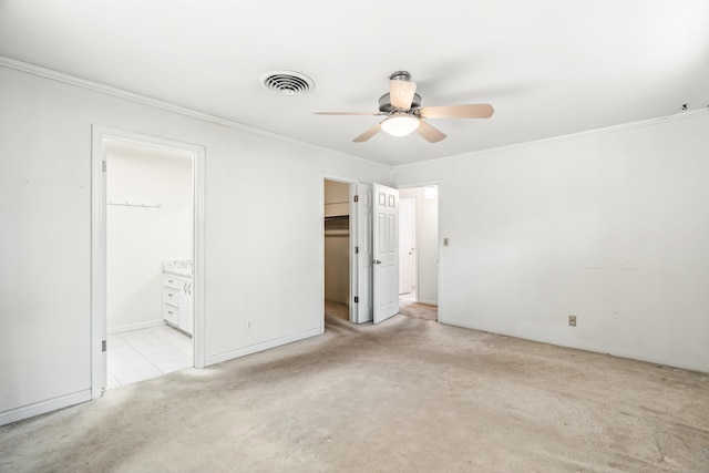 1198 Denton Way, Redding, CA 96002 - unfurnished bedroom featuring ornamental molding, carpet floors, ensuite bathroom, a walk in closet, and ceiling fan
