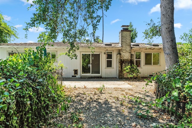1198 Denton Way, Redding, CA 96002 - back of house with a chimney and a patio area