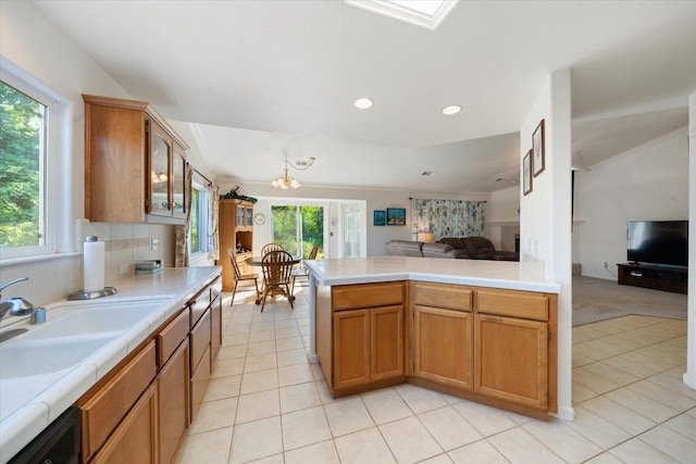 2790 Citrine Ave, Redding, CA 96001 - kitchen with open floor plan, light tile patterned floors, glass insert cabinets, recessed lighting, and tile counters