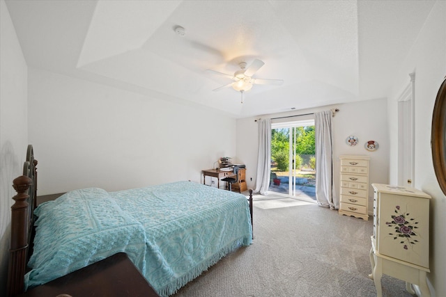 2790 Citrine Ave, Redding, CA 96001 - carpeted bedroom featuring a tray ceiling, access to exterior, and a ceiling fan