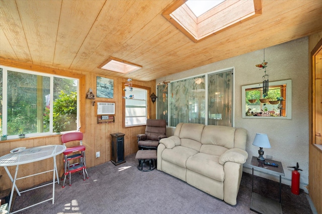 2790 Citrine Ave, Redding, CA 96001 - carpeted living room featuring a skylight, wood ceiling, a wall unit AC, and wood walls