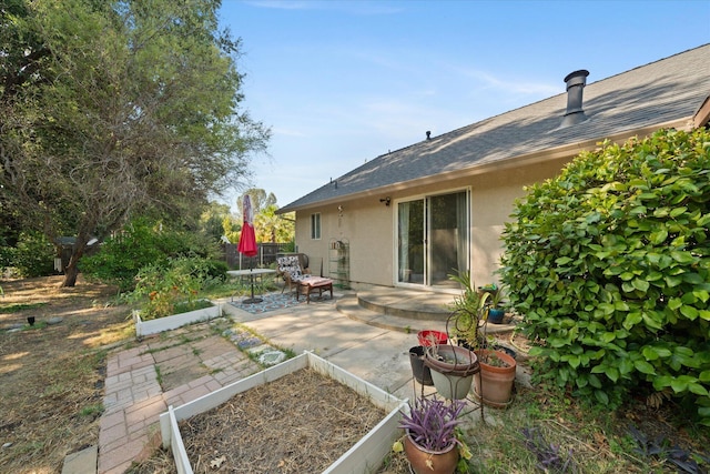 2790 Citrine Ave, Redding, CA 96001 - view of yard featuring a garden and a patio