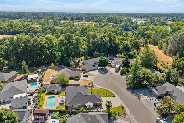 2790 Citrine Ave, Redding, CA 96001 - aerial perspective of suburban area with a heavily wooded area and a pool