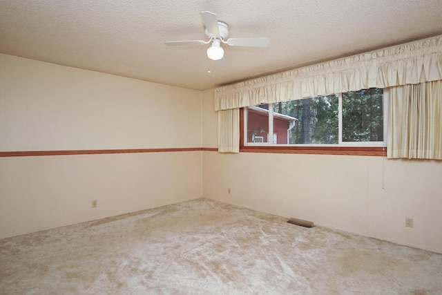 30839 Tinkerbell Ln, Shingletown, CA 96088 - spare room featuring carpet, a ceiling fan, and a textured ceiling