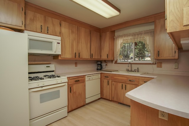 30839 Tinkerbell Ln, Shingletown, CA 96088 - kitchen featuring white appliances, light countertops, and light wood finished floors