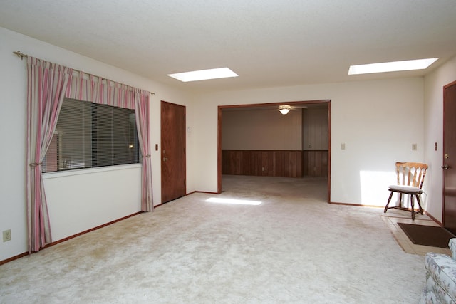 30839 Tinkerbell Ln, Shingletown, CA 96088 - carpeted spare room with a skylight and wainscoting