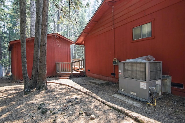 30839 Tinkerbell Ln, Shingletown, CA 96088 - view of side of home featuring crawl space and an outbuilding