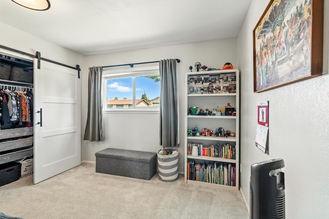 4020 Oro St, Redding, CA 96001 - carpeted bedroom featuring a barn door and a closet