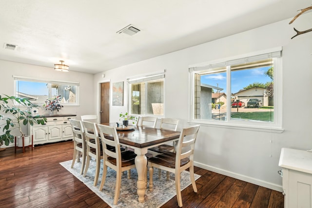 4020 Oro St, Redding, CA 96001 - dining area with dark wood-type flooring and baseboards