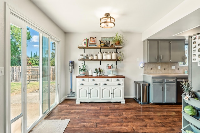 4020 Oro St, Redding, CA 96001 - kitchen featuring gray cabinetry, dark wood-type flooring, decorative backsplash, and light countertops