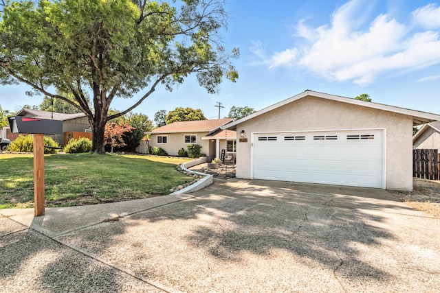 4020 Oro St, Redding, CA 96001 - ranch-style home featuring stucco siding, an attached garage, and driveway
