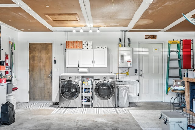 4020 Oro St, Redding, CA 96001 - washroom featuring washing machine and dryer, cabinet space, tankless water heater, and attic access