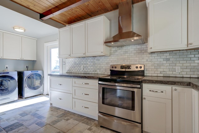 311 Ward Placer Pl, Weaverville, CA 96093 - kitchen with wall chimney range hood, stainless steel electric range oven, washer and clothes dryer, a wooden ceiling with exposed beams, and backsplash