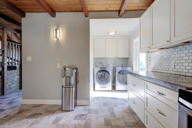 311 Ward Placer Pl, Weaverville, CA 96093 - laundry room with washer and clothes dryer, wood ceiling, stone finish floors, and cabinet space