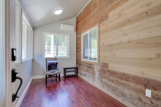 311 Ward Placer Pl, Weaverville, CA 96093 - living area featuring a wall mounted air conditioner, wood walls, vaulted ceiling, and dark wood finished floors