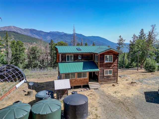 311 Ward Placer Pl, Weaverville, CA 96093 - rear view of house with a mountain view and a metal roof