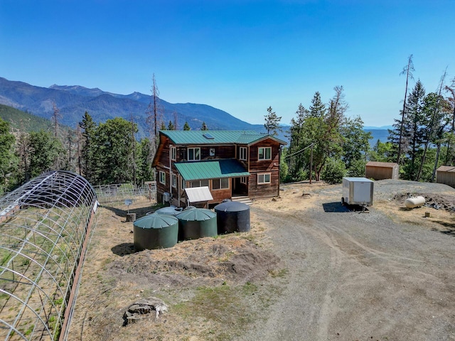 311 Ward Placer Pl, Weaverville, CA 96093 - view of front of house with a mountain view, a metal roof, and an outdoor structure