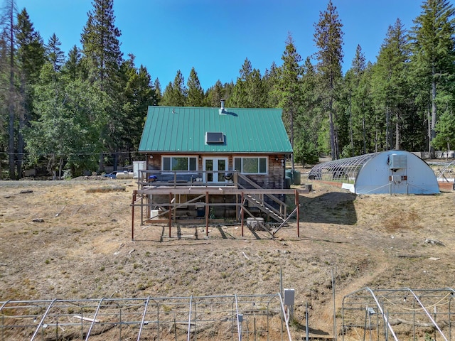 311 Ward Placer Pl, Weaverville, CA 96093 - rear view of house with a deck, stairway, a forest view, an outbuilding, and a metal roof