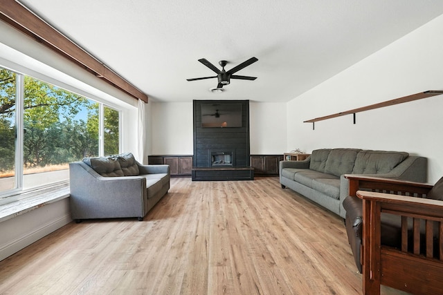 2045 Washington Ave, Red Bluff, CA 96080 - living area with ceiling fan, light wood-style floors, and a large fireplace