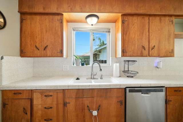 2045 Washington Ave, Red Bluff, CA 96080 - kitchen with stainless steel dishwasher, light countertops, decorative backsplash, and brown cabinetry