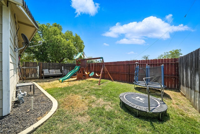 2045 Washington Ave, Red Bluff, CA 96080 - fenced backyard with a trampoline and a playground