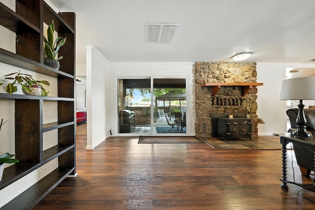 24470 Oklahoma Ave, Red Bluff, CA 96080 - living area with ornamental molding, a wood stove, and wood finished floors