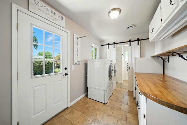 24470 Oklahoma Ave, Red Bluff, CA 96080 - washroom with cabinet space, washing machine and clothes dryer, and a barn door