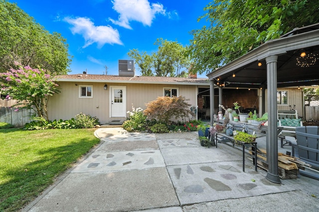 24470 Oklahoma Ave, Red Bluff, CA 96080 - rear view of house with a patio area, a chimney, and a shingled roof