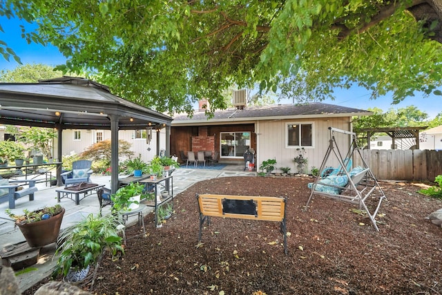24470 Oklahoma Ave, Red Bluff, CA 96080 - back of house with a fire pit, a gazebo, and a patio