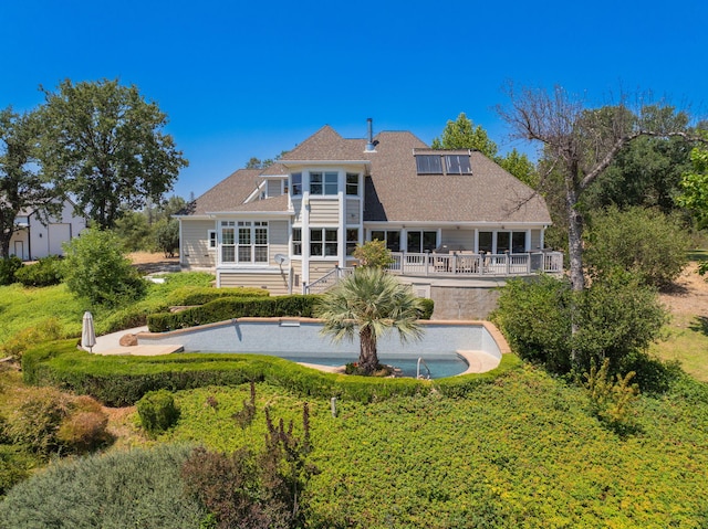 23795 Deer Canyon Rd, Millville, CA 96062 - back of house featuring an outdoor pool, a wooden deck, and roof with shingles