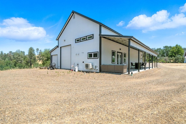23795 Deer Canyon Rd, Millville, CA 96062 - view of side of property featuring a garage, outdoor lounge area, and a patio area